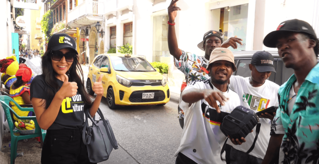 Roxeus with local rappers in Cartagena, Colombia, capturing the vibrant street culture.