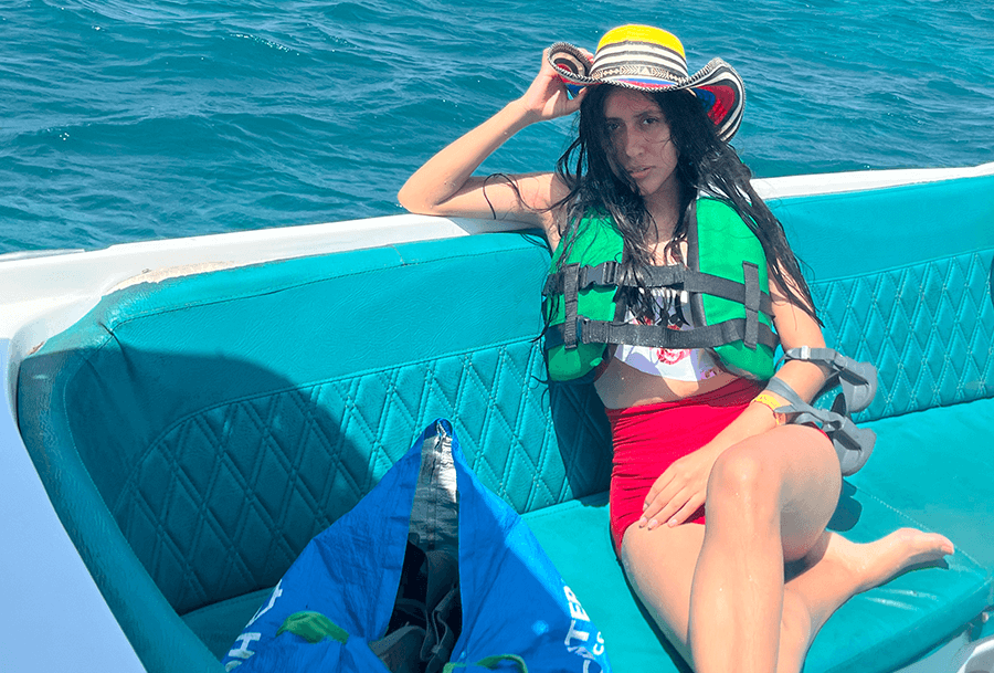 Roxeus relaxing on a boat during her island-hopping tour in Rosario Islands, Cartagena