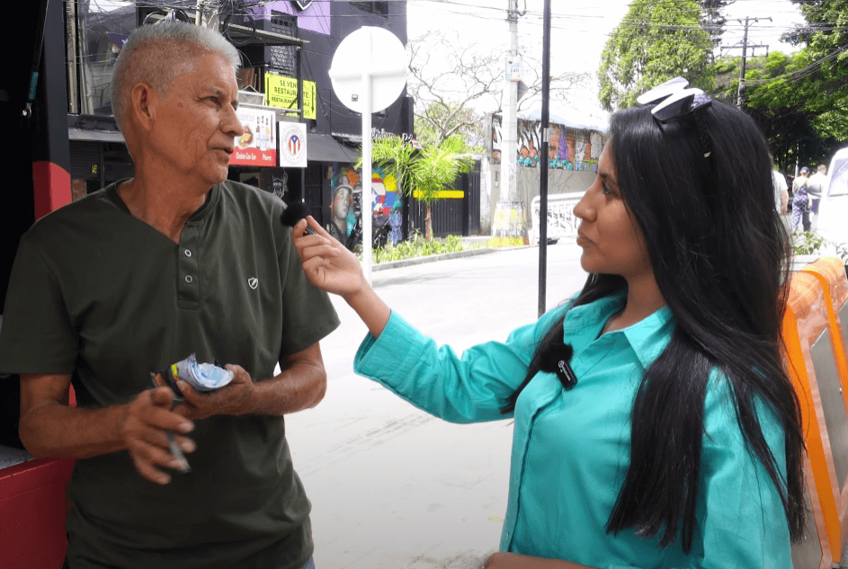 Francisco Estrada, a local street artist in Medellin, being interviewed about the support for street art from expats and locals